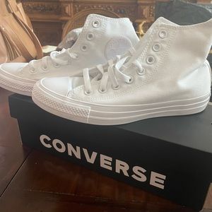 Brand new, in the box. All white converse size 10